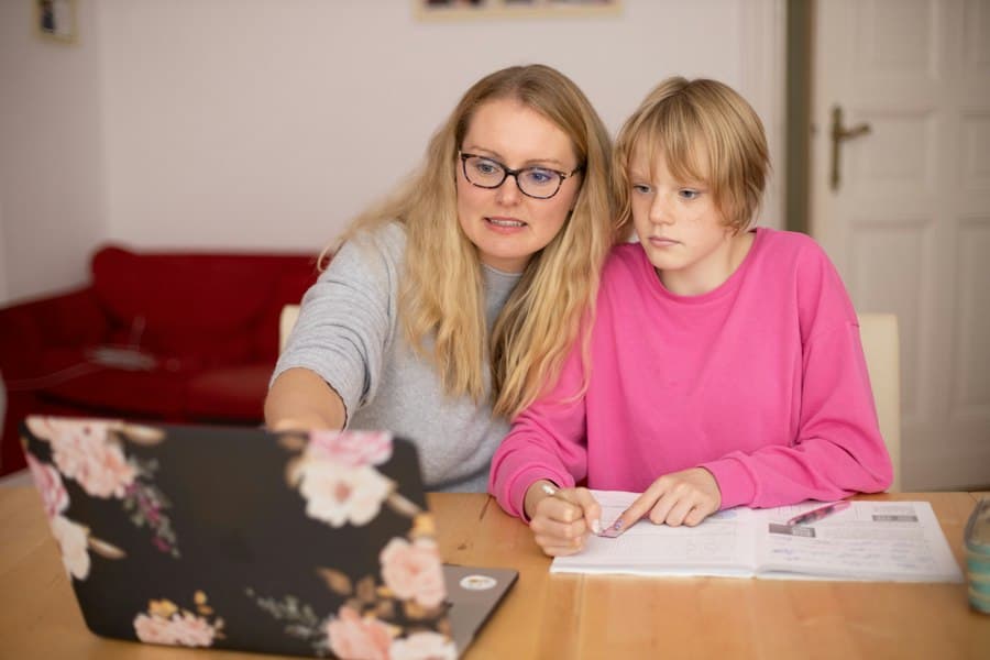 A tutor helping a child with homework